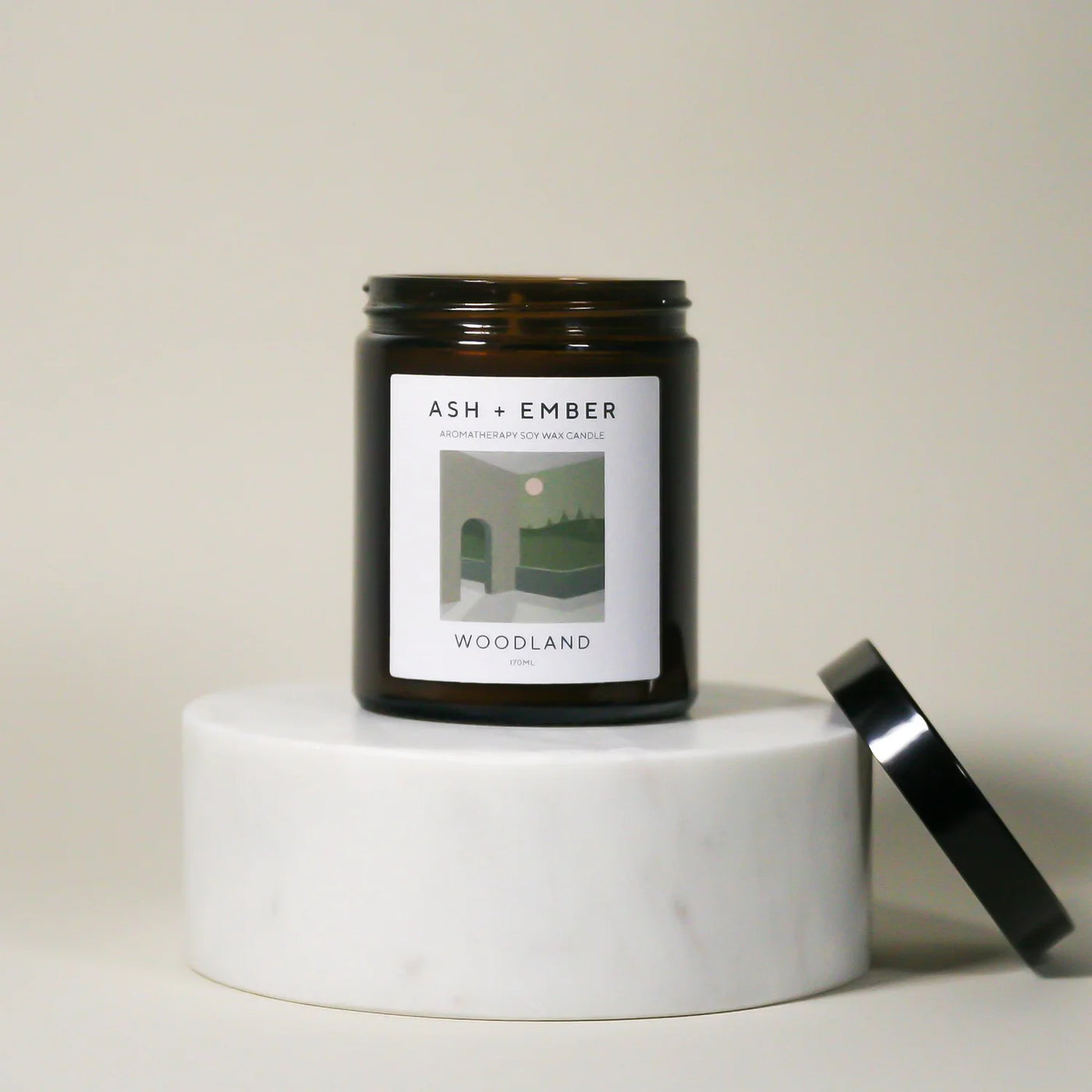 Candle with a label on a white surface