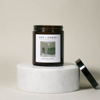 Candle with a label on a white surface