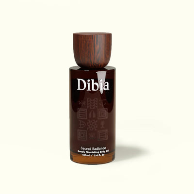 Brown bottle with wooden cap labeled 'Dibia' on a white background