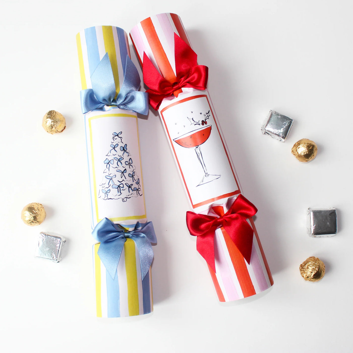 Two colorful cracker packages with ribbons on a white background