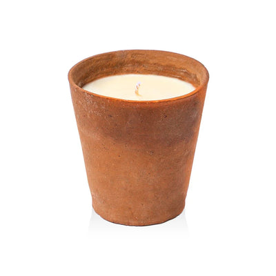 Candle in a terracotta pot on a white background