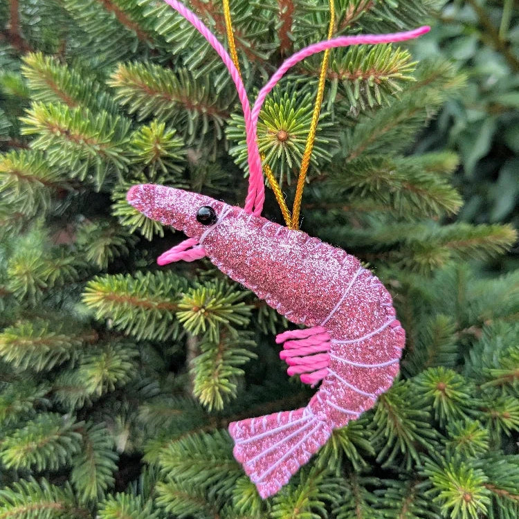 Pink glittery shrimp ornament on a Christmas tree