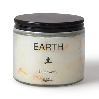 Jar of bath salts labeled 'Earth Homework' on a white background
