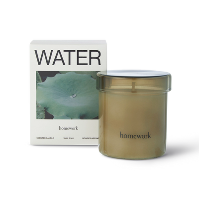 Homework candle with packaging labeled 'Water' on a white background