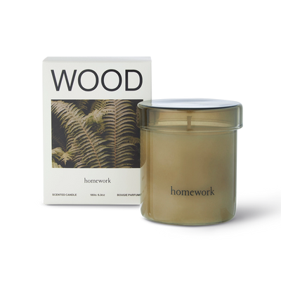 Candle labeled 'homework' with a packaging box featuring the word 'WOOD'.