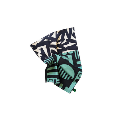 Folded tea towel with geometric pattern on a white background