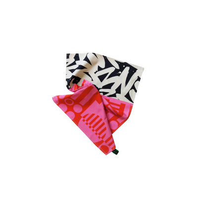 One patterned tea towel pink with geometric design, on a white background.