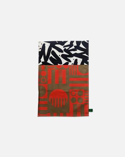 Multicolored patterned towel with geometric and abstract designs on a white background