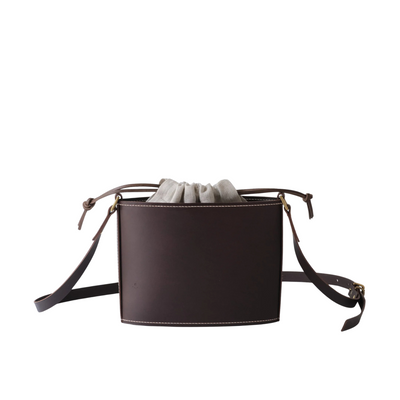 Leather bag on white backdrop