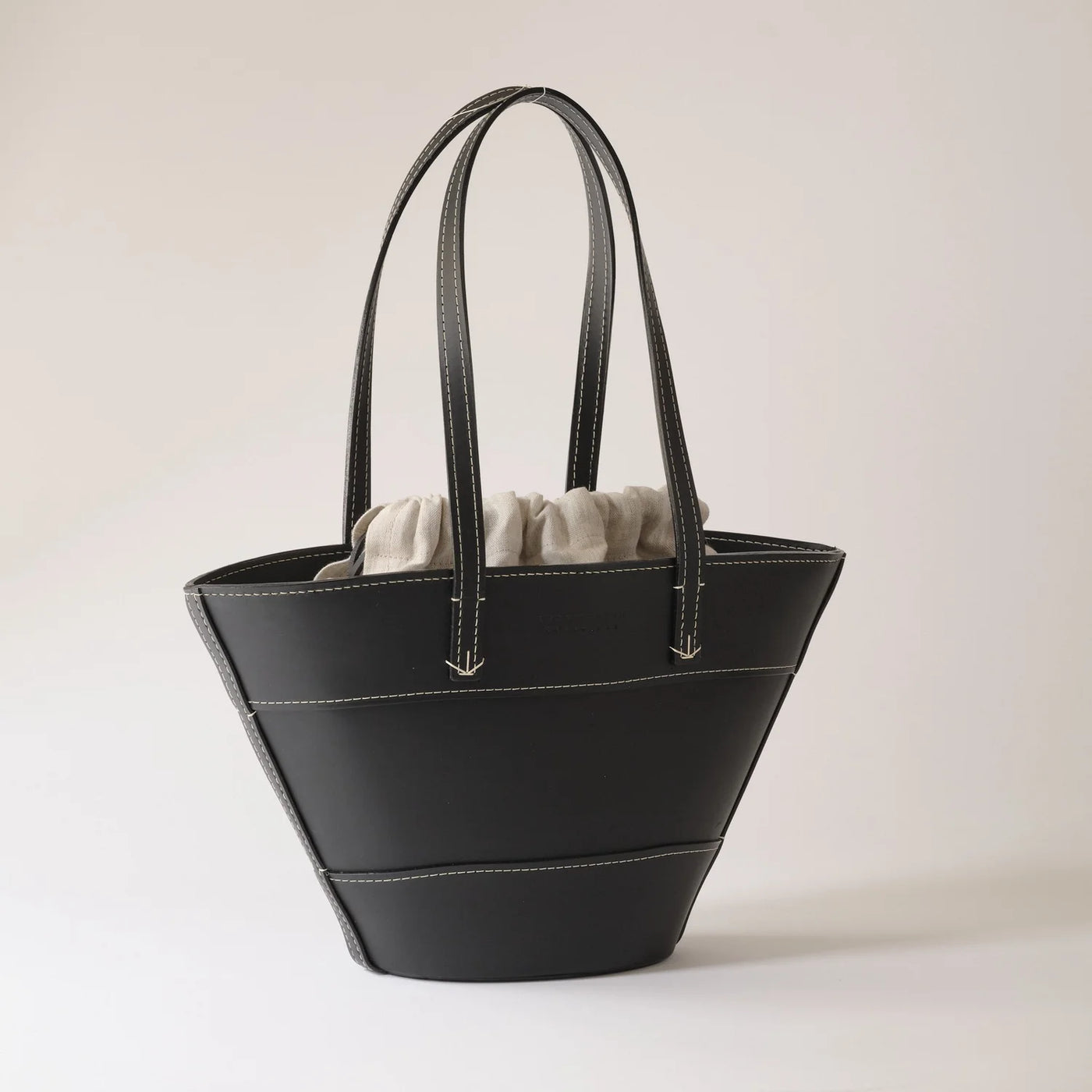 Black handbag on a light gray background