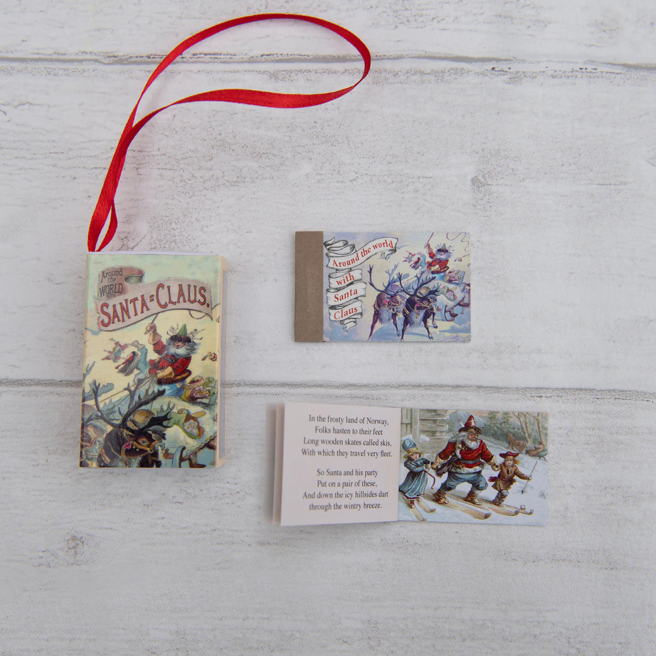 Set of vintage-style cards with illustrations and text on a wooden surface