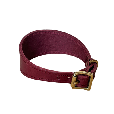 Maroon leather belt with a gold buckle on a white background