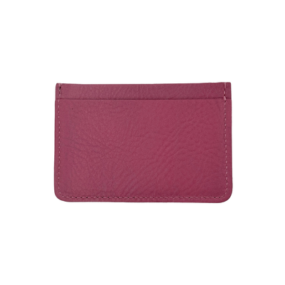 Pink leather cardholder on a white background
