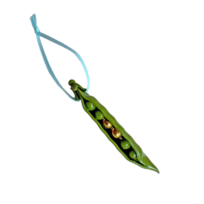 Green pea pod charm with three peas on a white background