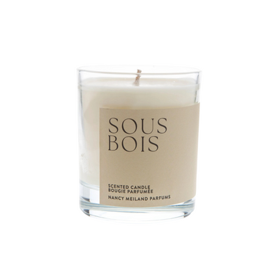 Scented candle with 'Sous Bois' label on a white background