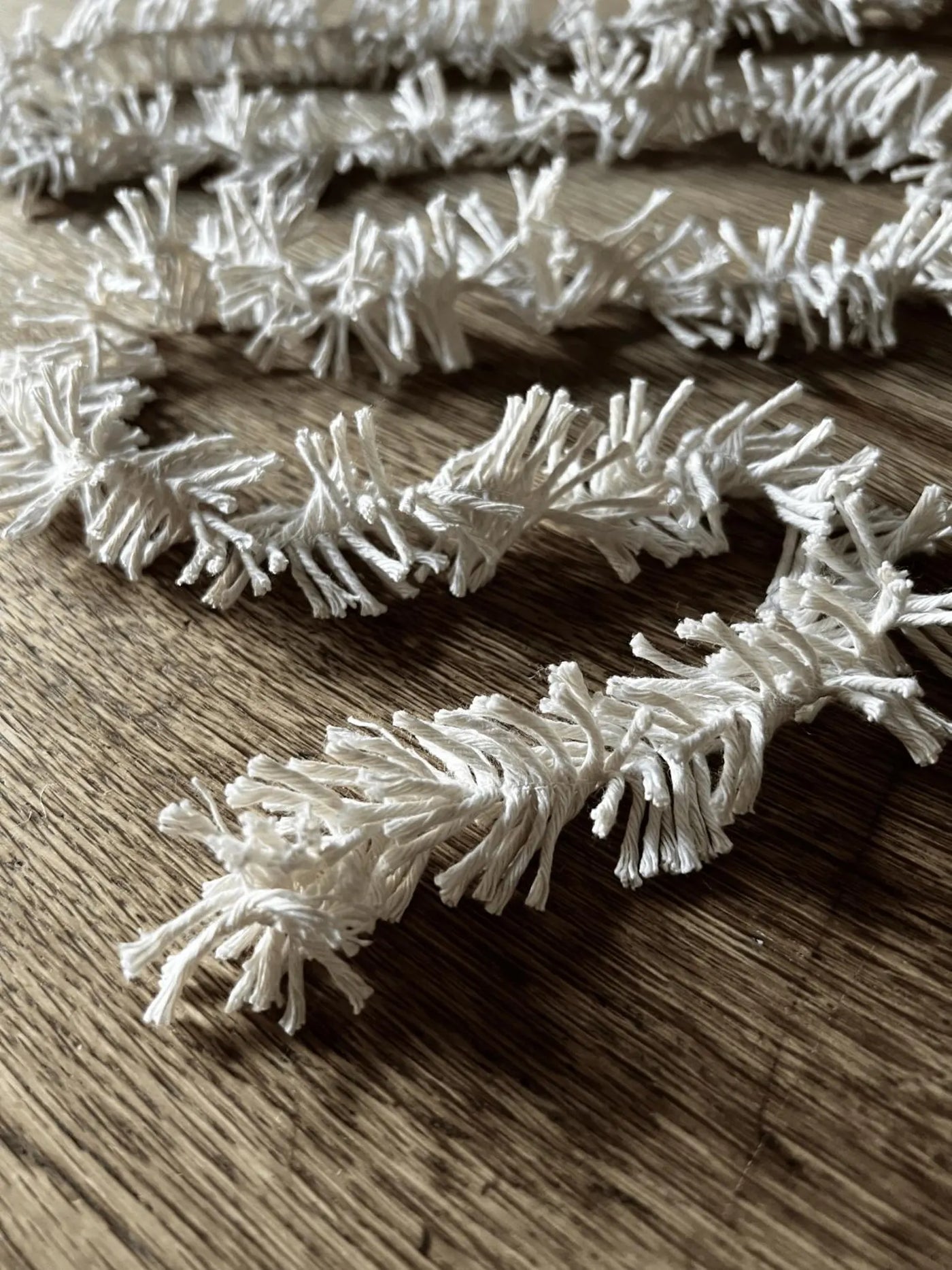White decorative branches on a wooden surface