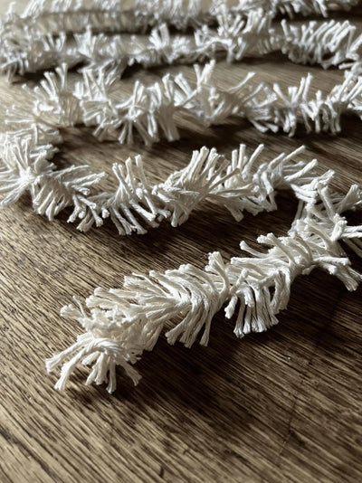 White decorative branches on a wooden surface