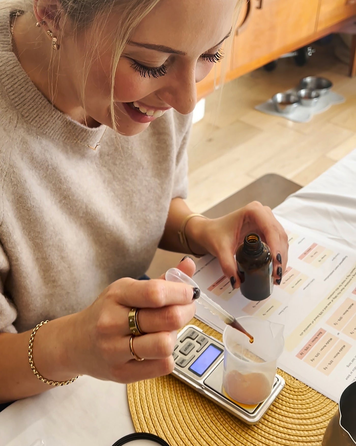 Woman measuring ingredients on a kitchen counter